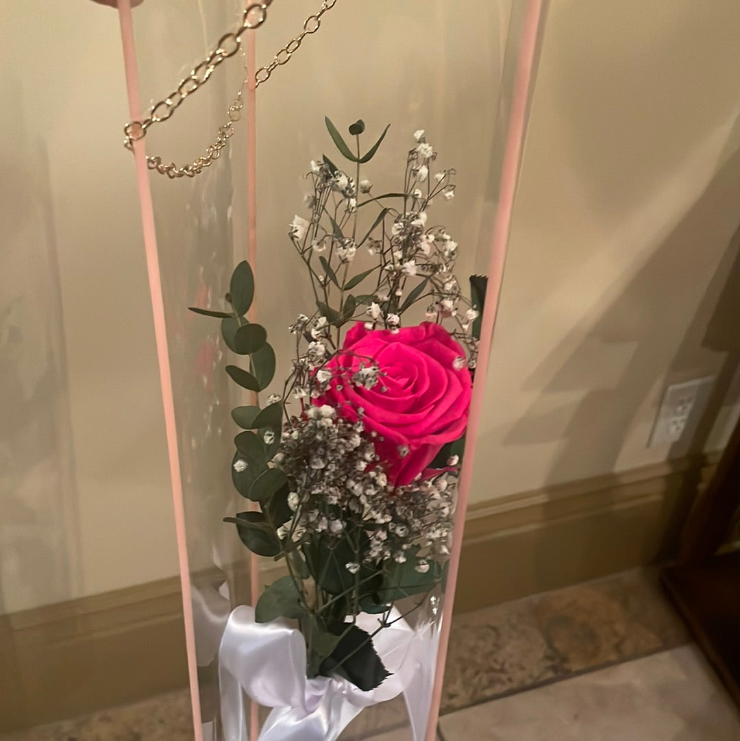 Single preserved rose in a handle bag